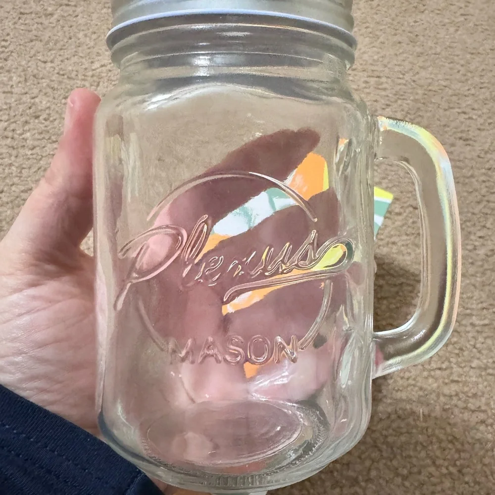 Mason jar with lid and straw